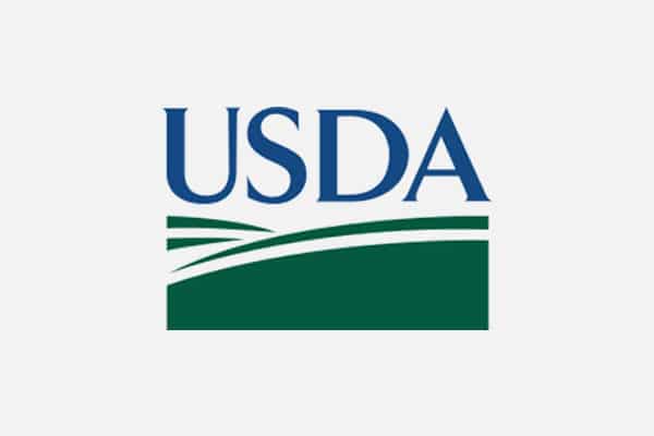 USDA logo featuring the letters "USDA" in blue above a green stylized field with curved lines, representing the United States Department of Agriculture. The background is white.